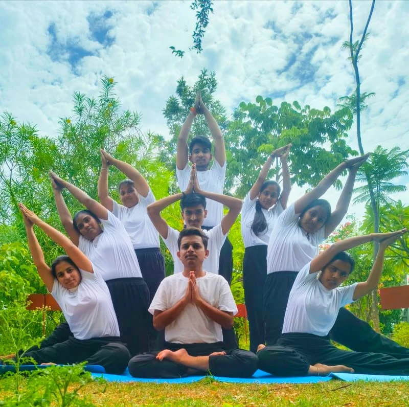 Students practicing yoga at Swamy Vivekananda Naturopathy College